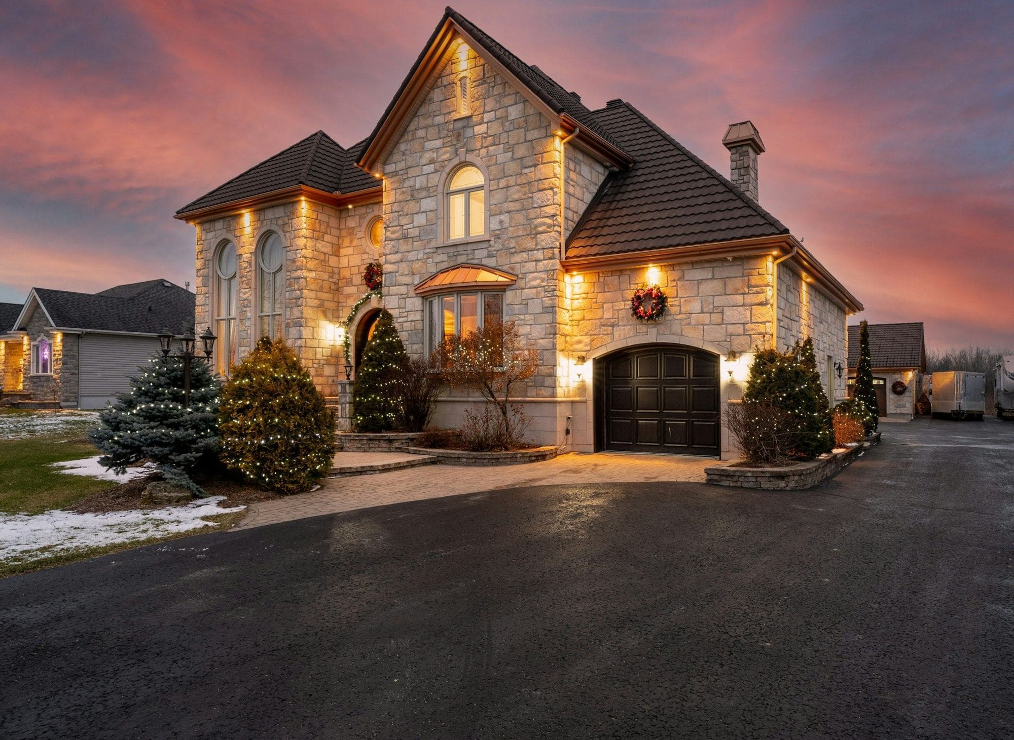 Stone house lit at dusk